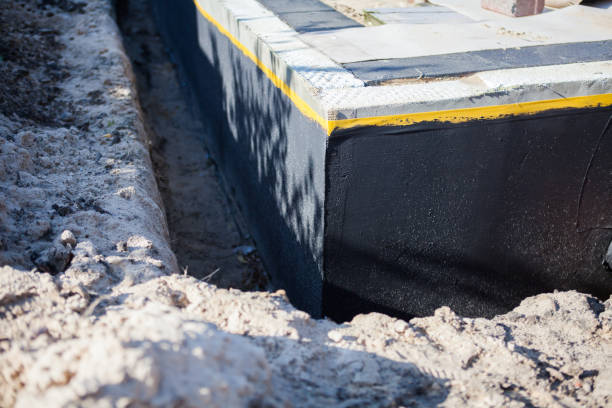 Professional Basement Waterproofing technician working in Lebanon, VA